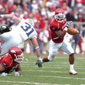Arkansas tail back Michael Smith runs to the outside against Auburn in the first half Saturday in Ra...