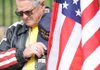 Patriot Guard Odie Tresner of Bella Vista pauses during a moment of prayer during a ceremony in recognition of U.S. soldiers taken as prisoners of war and those missing in action at the Arkansas Fallen Heroes Living Memorial Saturday at the Veterans Home in Fayetteville. 


