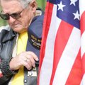 Patriot Guard Odie Tresner of Bella Vista pauses during a moment of prayer during a ceremony in reco...