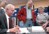 Capt. Chesley “Sully” Sullenberger signs Saturday his book Highest Duty: My Search for What Really Matters for Terry and Regina Thomason of Rogers at the south Rogers Wal-Mart Supercenter. 
