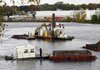 Crews dredge a Hudson River section in Fort Edward, N.Y.