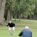 Rick Iselin, left, and Brian Arend sized up a putt on the par 4, No. 10 hole at Shadow Valley Countr...