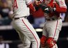 Philadelphia Phillies relief pitcher Brad Lidge celebrates with catcher Carlos Ruiz after Lidge retired Colorado’s Troy Tulowitzki for the final out of the Phillies’ 5-4 victory Monday.