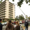 University of Arkansas students stand in front of Humphreys Hall after residents were evacuated as F...