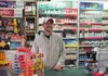Joe Pierce at work Monday behind the counter of Pointer Express 2 in Van Buren, where he won $100,000 playing the Arkansas Lottery.