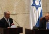 Israeli President Shimon Peres listens to Prime Minister Benjamin Netanyahu during the opening of the winter session at Israel’s parliament in Jerusalem on Monday.