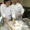 Pastries instructor Tammy Varney of Springdale works with student Frank Bailey of Fayetteville on ro...