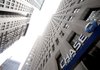 A JPMorgan Chase & Co. branch towers above the sidewalk in New York. The bank on Wednesday reported strong earnings.