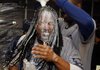 Manny Ramirez of the Los Angeles Dodgers is doused by Guillermo Mota on Saturday. The prospect of a Freeway World Series between the Dodgers and the Los Angeles Angels remains.