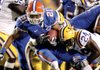 Florida wide receiver Chris Tolliver (21) is stopped by LSU linebacker Harry Coleman (24) in the first half of Florida's 13-3 win over the Tigers in Baton Rouge, La., on Oct. 10.