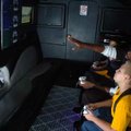 Terrell Washington, 10, gets some advice from Glenn James, marketing associate with Nerjyzed Enterta...