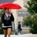 Class bound Joanne Johnson of Jacksonville walks Tuesday along Dickson Street at the University of A...