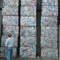 Washington County Justice of the Peace Steve Zega looks at stacks of aluminum cans Wednesday during ...