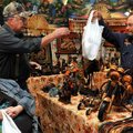 Linda Sisemore of Elkins and her husband, Randel, purchased some homemade crafts and leather from Do...
