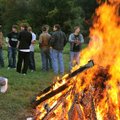 Students gathered around the bonfire during a pep rally at Bentonville High School as part of the Te...
