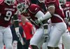 Auburn running back Mario Fannin found out what kind of player Arkansas’ Jerico Nelson (center) is after taking a head-on shot and locking helmets in the Razorbacks’ 44-23 victory Saturday. Now Arkansas’ main problem is keeping Nelson fresh for the positions he plays.
