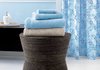 Holding towels in the bathroom is just one use for this stylish piece with an
hourglass figure. Woven of abaca on a powder-coated metal stand reinforced
with plywood for interior stability, its natural variegated tones complement a
variety of furniture finishes. The versatile piece can be used as a bathroom or
vanity stool, nightstand, end table or ottoman and sells for $119 from Crate
and Barrel.