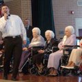 Seth Livingston with Alliance Home Health sings as judges tally final results Friday for the Arkansa...