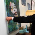 Faron Smith, the owner of Ideas Antique and Modern Decor in downtown Bentonville, put up a painting ...
