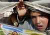 A Pakistani boy, who fled the military offensive in South Waziristan, looks out from a vehicle as he and his family wait for security clearance upon arrival at a checkpoint on the outskirts of Dera Ismail Khan, Pakistan, on Sunday.