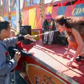 Daisy Ubiles of Alexander pulls a sword out of the mouth of sword swallower Diane Falk on Sunday, th...