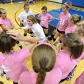 Woodland Junior High volleyball coach Jennifer Taylor speaks to her team during a time out in the Co...