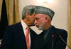 Afghan President Hamid Karzai confers with U.S. Sen. John Kerry during a news conference Tuesday in Kabul after a day of talks between Kerry and Karzai over the disputed election.