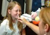 Shyanne Walden, 10, reacts after nurse Shelley Hollingsworth gives her the H1N1 mist vaccine Tuesday at Elkins Middle School. The school offered H1N1 vaccines as well as the seasonal flu shot to students after parent-teacher conferences.