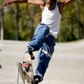 Patrick Johnson, 22, of Fayetteville attempts a jump on his skateboard Tuesday at Walker Park in Fay...