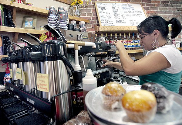 lareina-sweeden-prepares-an-espresso-drink-behind-the-counter-of-bookends-cafe-in-the-central-arkansas-library-systems-cox-creative-center-on-commerce-street