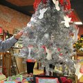 Bill Oakley of Bentonville picked a Sunshine School student to help from the angel tree while he att...