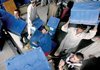 Afghan workers load ballot boxes onto trucks Thursday at the Independent Election Commission compound in Kabul as the U.N. began sending out voting kits for the Nov. 7 presidential runoff.