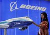 A visitor looks at a model of the Boeing 747-8 displayed at the Asian Aerospace International Exposition in Hong Kong in September.