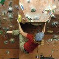 University of Arkansas student Andrew Gertsch practices “bouldering”Wednesday at the Outdoor Connect...