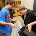 Rogers High School senior Steven Boak, left, and junior Dustin Sims collected office waste for recyc...