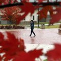 A student walks across campus on a rainy Thursday at Northwest Arkansas Community College in Bentonv...