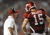 Arkansas sophomore quarterback Ryan Mallett, right, speaks to coach Bobby Petrino during the Hogs' 52-41 loss to Georgia Sept. 19 in Razorback Stadium.
