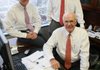 Brian Bush (left), Alan Tedford (standing) and Bill Tedford, all vice presidents with Stephens Capital Management, say the Federal Reserve’s increase in the monetary base will spur inflation.