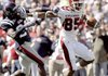 Greg Childs fights off Mississippi’s Cassius Vaughn with a stiff-arm to the helmet while trying to reach the end zone in the second quarter. Childs caught three passes for 83 yards, but had trouble holding the ball on several occasions.