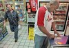 Bobby Perkins scratches off lottery tickets at Zimmerman’s Exxon on South University Avenue in Little Rock.