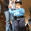 Officer Brady Wilker, 2, led his mother, Melissa Wilker, and his 4-month-old convict brother away on...