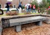 Students at the University of Central Arkansas in Conway on Monday walk past part of a memorial for two students who were killed on the campus in October 2008.