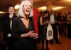 Louise Schaper, retiring executive director of the Fayetteville Public Library, laughs during a reception in honor of her service to the library and to mark her retirement Sunday at the library. 

