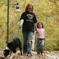 Stephanie Owen of Bentonville enjoys a walk Sunday with her niece Trinity Fox, 3, of Bentonville and...