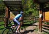 Jake Stechmann, 30, of Bella Vista, rode his mountain bike onto the Slaughter Pen Hollow Trail in Bentonville on Monday.

