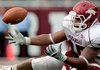 Arkansas's DJ Williams attempts to catch a pass as Alabama's Eryk Anders defends in the third quarter during the Razorbacks game against Alabama in Tuscaloosa.
