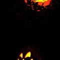Two jack-o’-lanterns were lit up on a porch on the corner of Southeast Third and A streets in Benton...