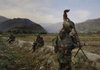 An Afghan soldier prepares to go on patrol Tuesday with his unit in the Pech Valley of Kunar province.
