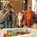 Donna Schwartz smells hot peppers with her friends Dan Angell and his wife, Jenny, during the last T...