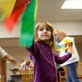 JoAnna Saunders, 4, of St. Paul parades around the room with streamers Tuesday at Springdale Public ...